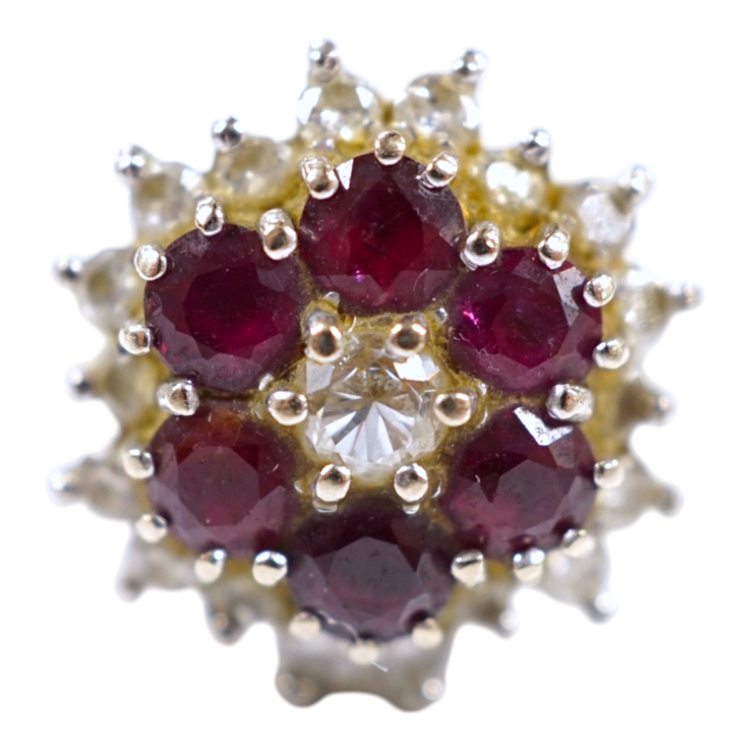 An 18ct white metal, ruby and diamond cluster ring, size P, gross weight 7 grams. Condition - fair